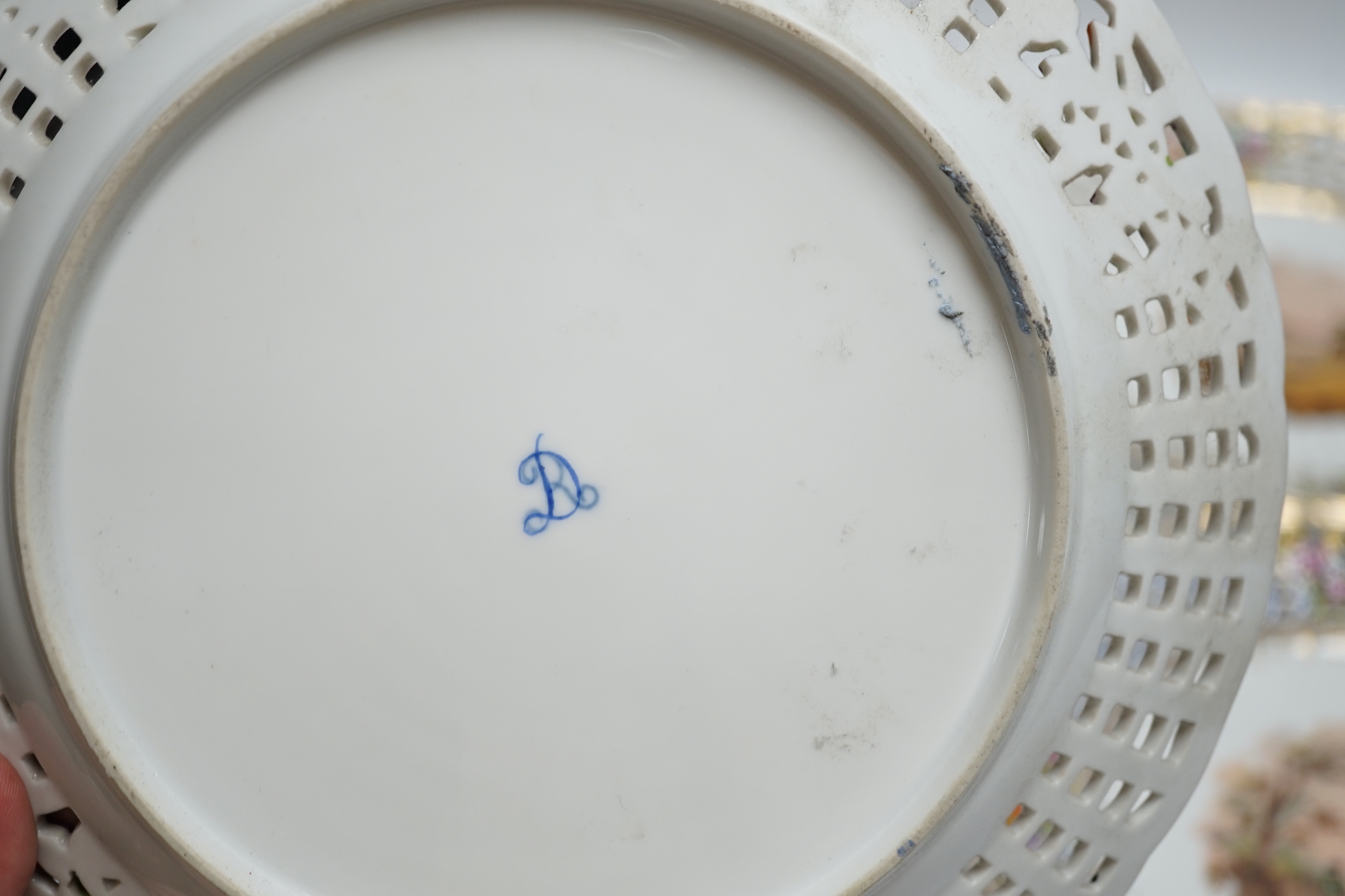 A set of four Dresden porcelain cabinet plates decorated with landscapes, 22cm diameter